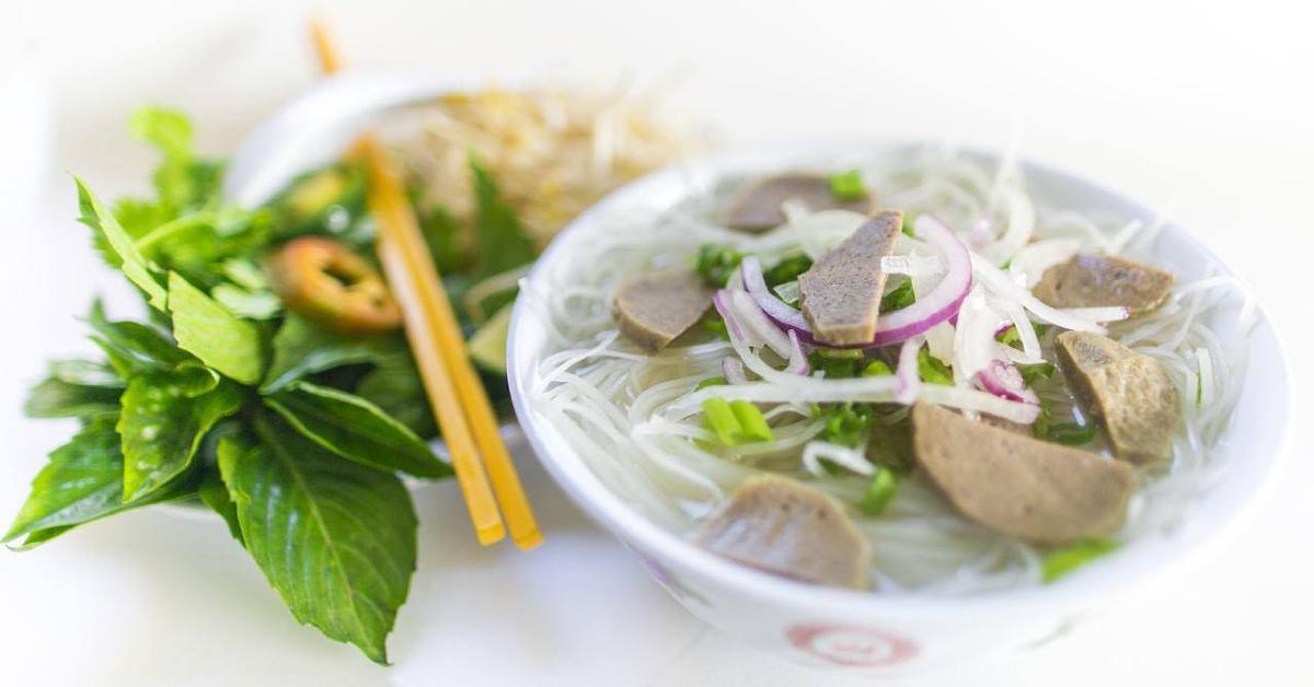 Photo of a bowl of pho adjacent chop sticks from Á Đông restaurant in Des Moines, Iowa