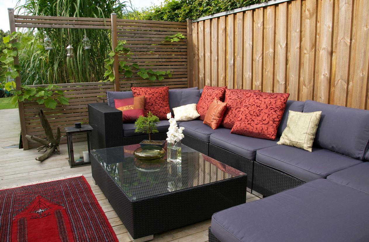 Privacy deck wall surrounded outdoor couch and table