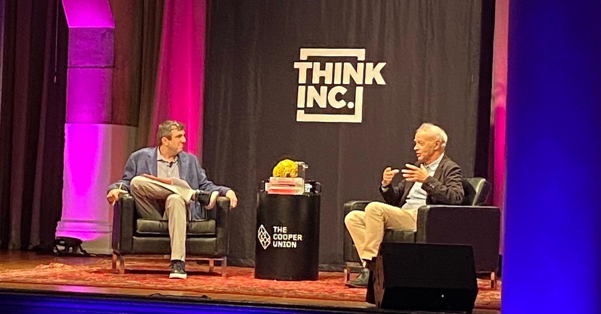 A.J. Jacobs and Peter Singer on stage at the Cooper Union