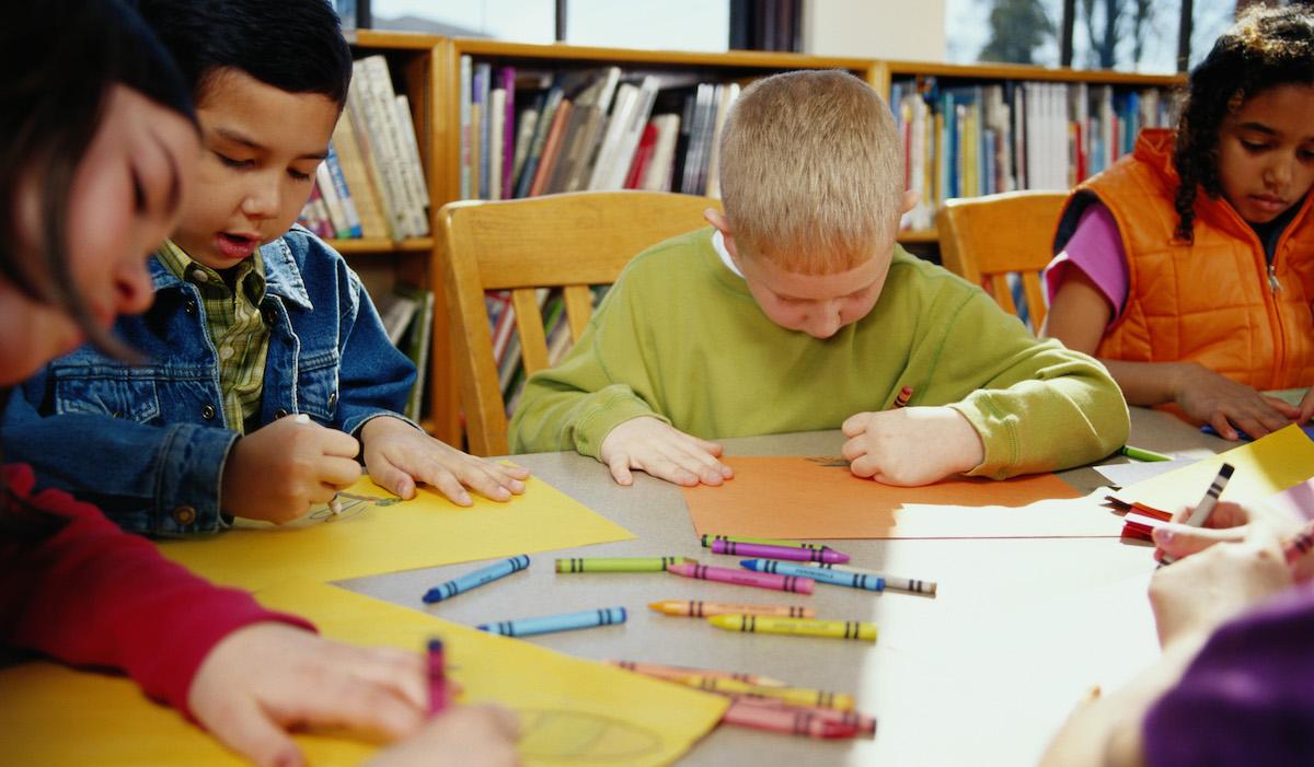 Kids drawing with crayons