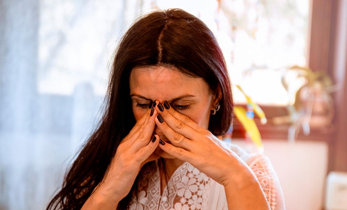 Brunette woman having sinus pain