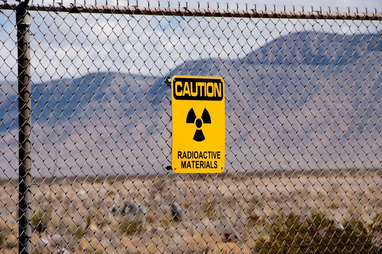 Radioactive materials sign on fence