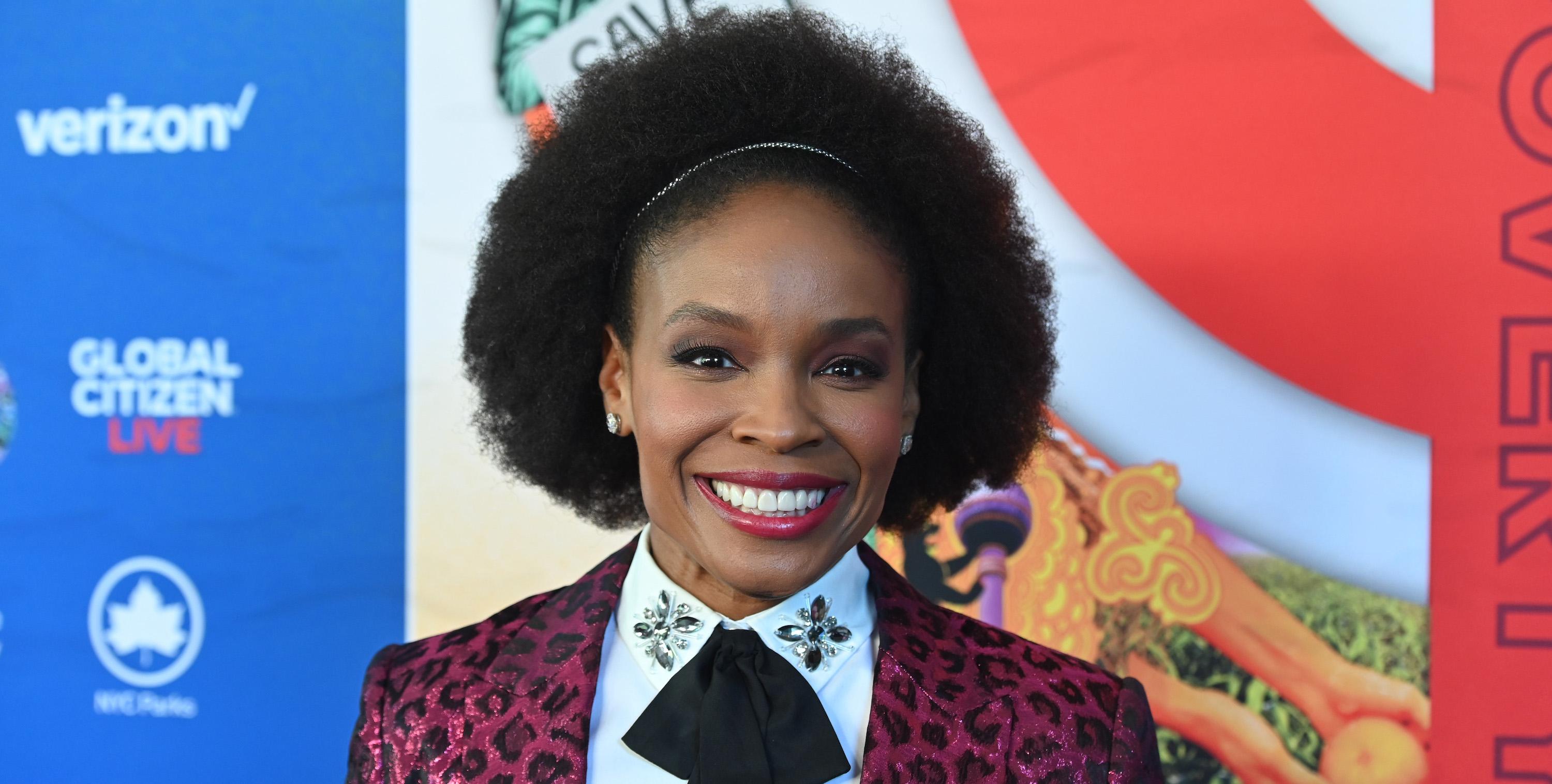 Amber Ruffin smiles on a red carpet