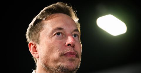 A close-up picture of Elon Musk's face from a downward angle