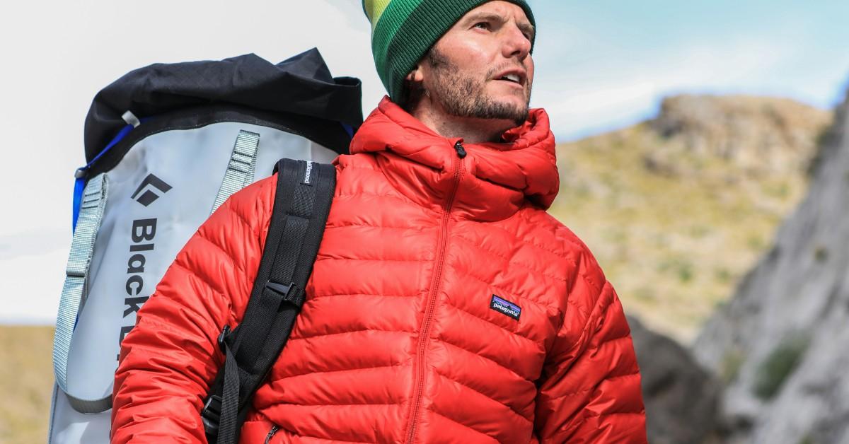 A man wears a red Patagonia jacket 