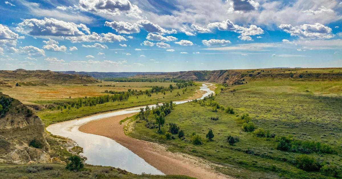 A river runs through the picturesque landscape of a North Dakota park