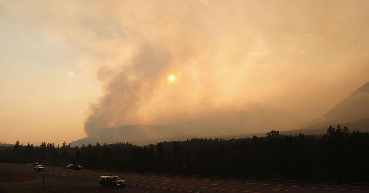 Smoke rises from the Robert Fire in Glacier National Park.