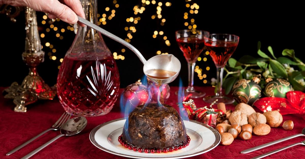 A vegan Christmas pudding set aflame with alcohol. 