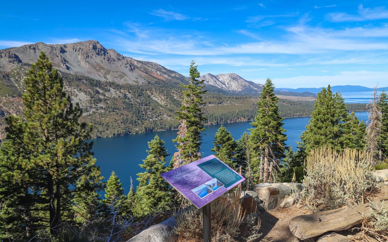 Interpretive signage on a trail in Lake Tahoe with mountain view in the background