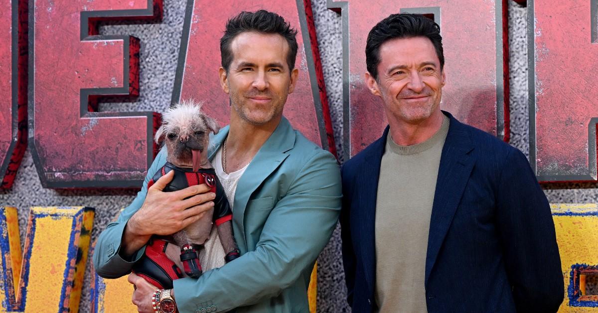 Ryan Reynolds and Hugh Jackman pose with Peggy on the red carpet for the UK premiere of the trio's new movie