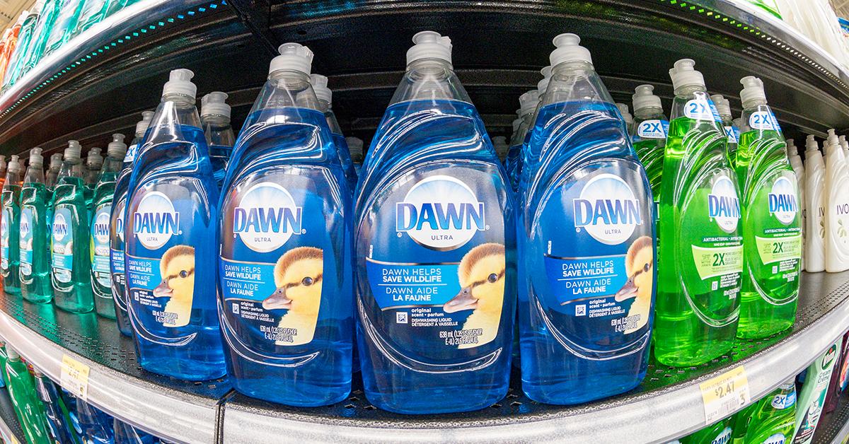 A store shelf stocked with Dawn dish soaps