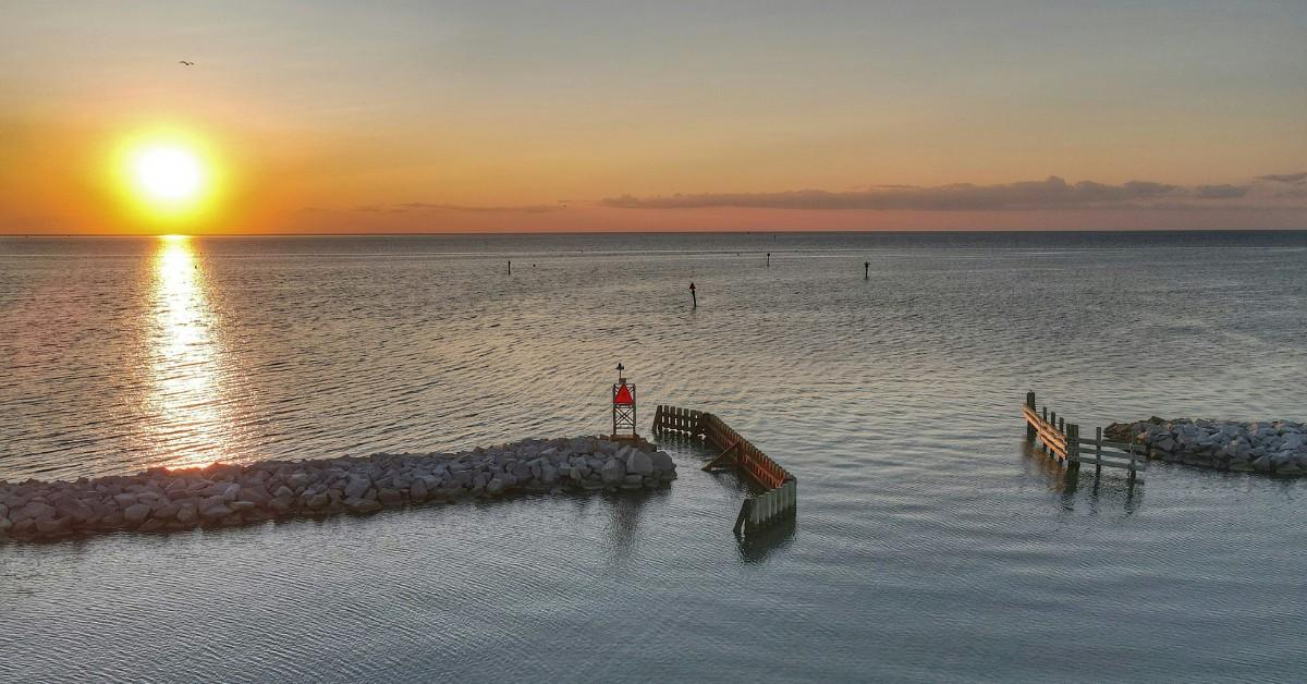 The sun sets over the calm waters of Hatteras Island