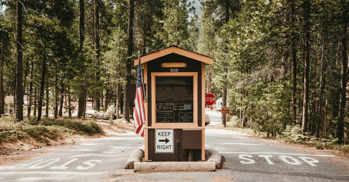 A security booth sits at the entrance of Yellowstone National Park