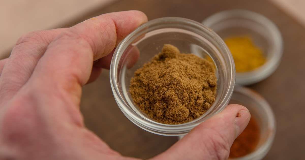 A person holding a cup of ground ginger. (Representative Cover Image Source: Getty Images | Annick Vanderschelden Photography)