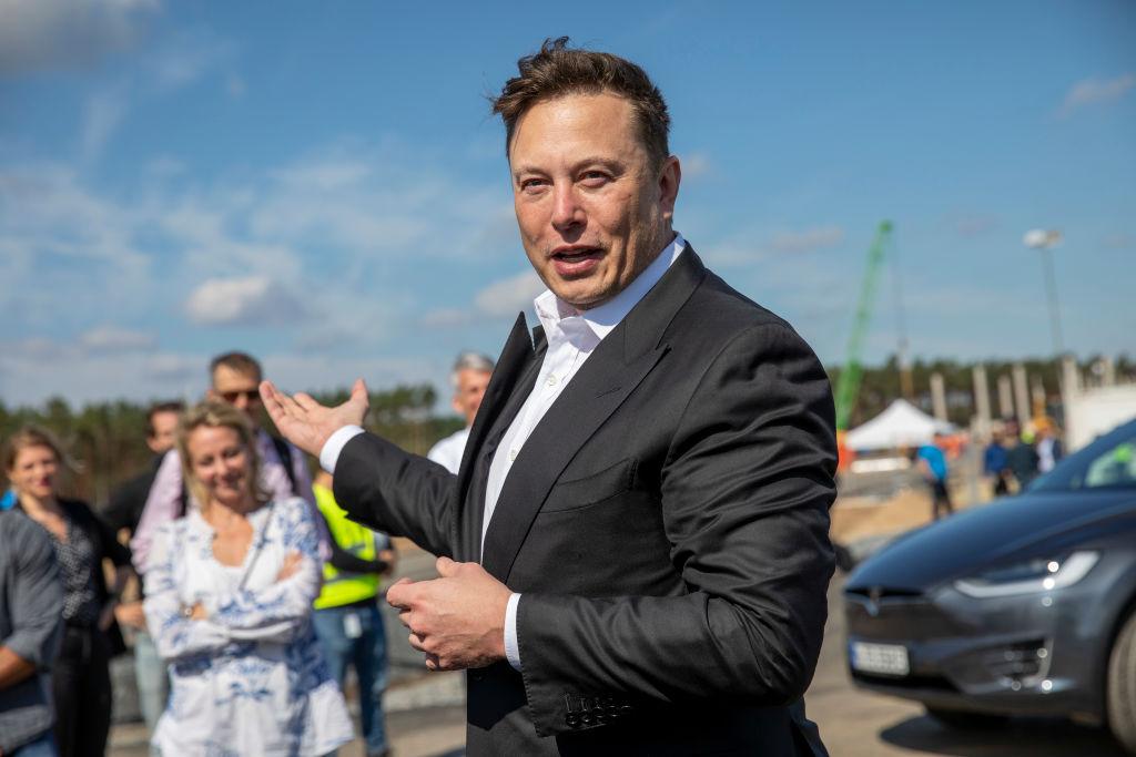 This photo of Elon Musk in a suit at the site of the Tesla Gigafactory near Berlin, Germany in September 2020 has been used in ads for an energy-saving device linked to his name.