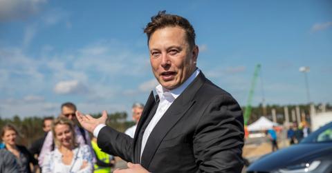 This photo of Elon Musk in a suit at the site of the Tesla Gigafactory near Berlin, Germany in September 2020 has been used in ads for an energy-saving device linked to his name.