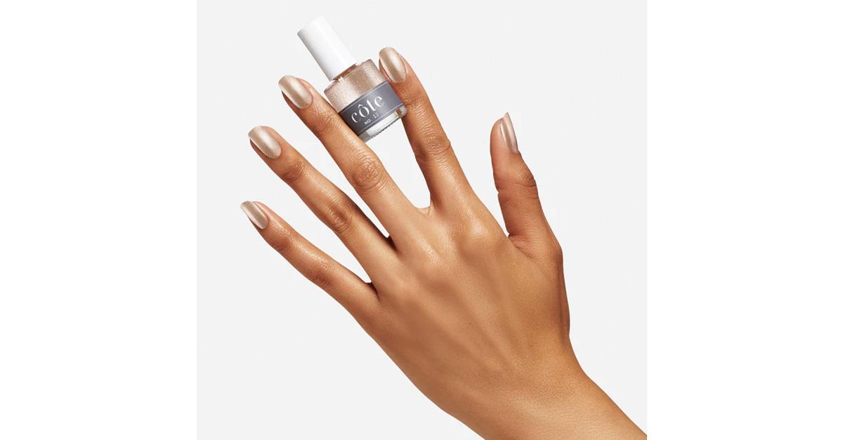 Chrome nail polish by Côte in someone's hand