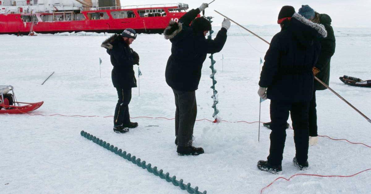 Scientists drilling into the Arctic ice sheet. (Representative Cover Image Source: Getty Images | James L. Amos)