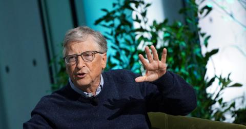 Bill Gates talking with one hand held up
