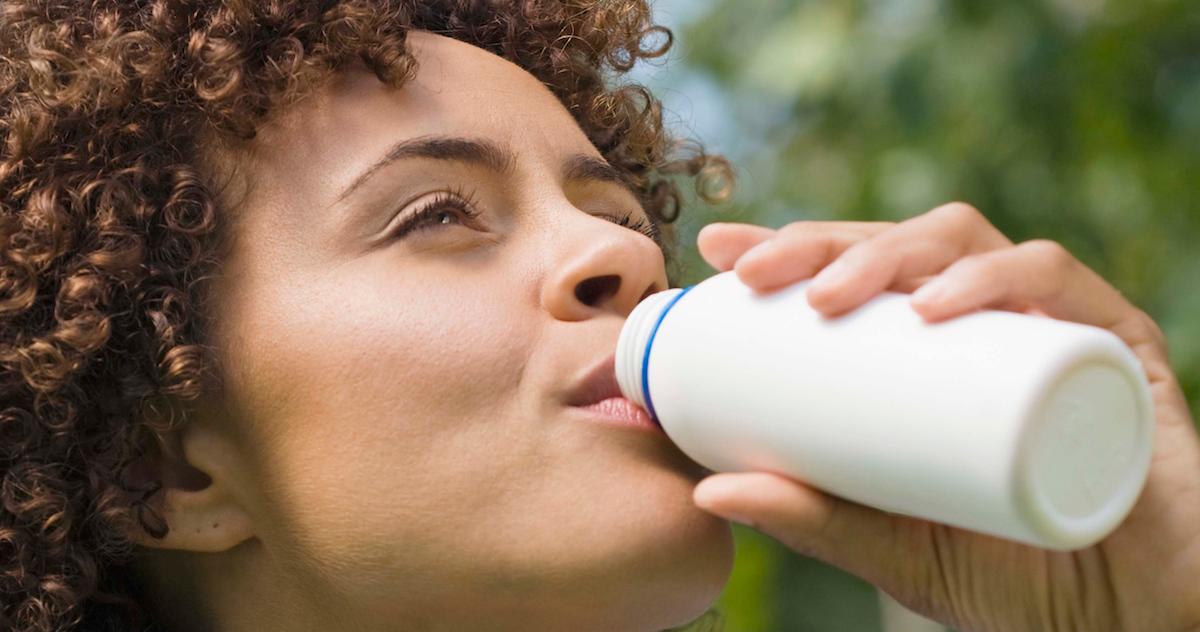 Woman drinking probiotic-rich kefir