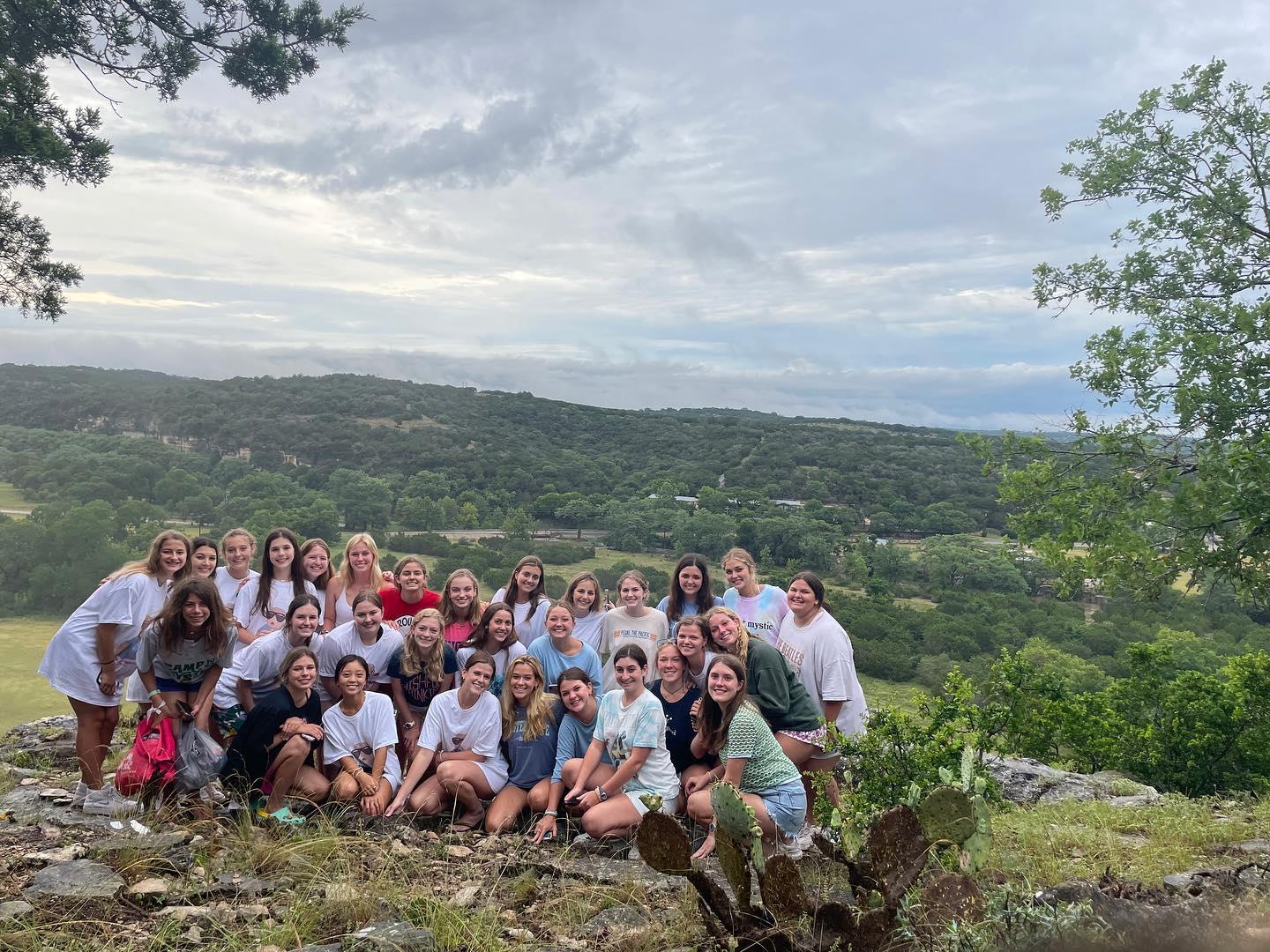Campers pose while smiling at Camp Mystic in Texas.