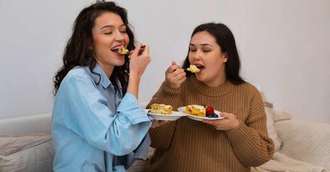 Two women are enjoying sugary treats in their living room. (Representative Cover Image Source: Freepik)