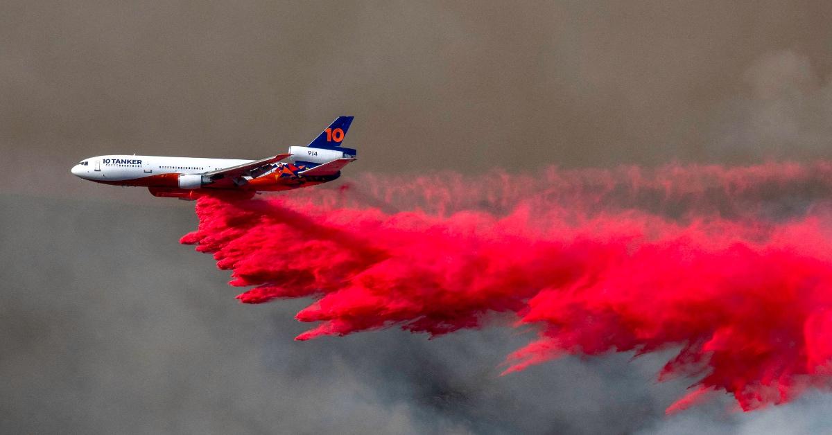 A plane drops hot pink flame retardant on wildfires in Los Angeles, California.