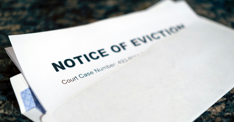 An envelope contains a notice of eviction document