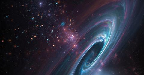 Supermassive black hole surrounded by a tapestry of glittering stars (Representative Cover Image Source: Getty Images | Lothar Knopp)