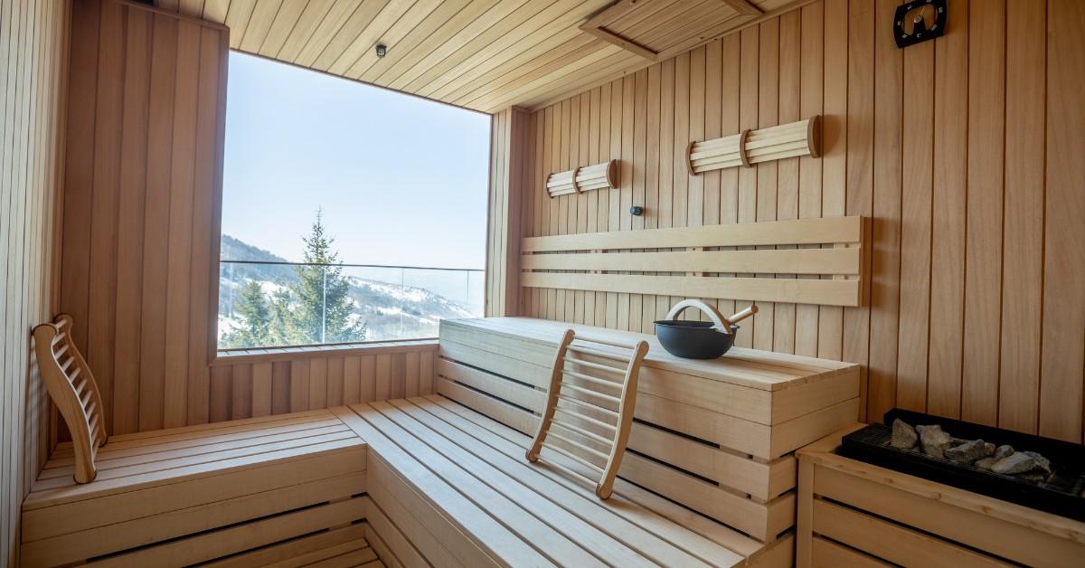 Interior of a well lit sauna with a view