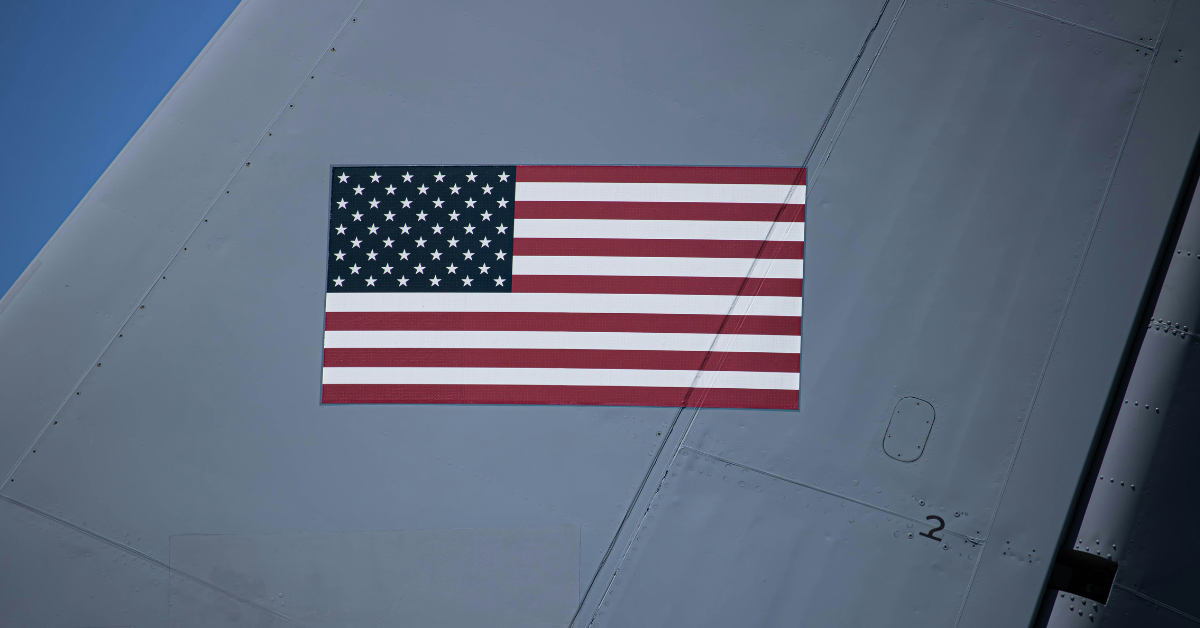 An American flag appears on the wing of a plane