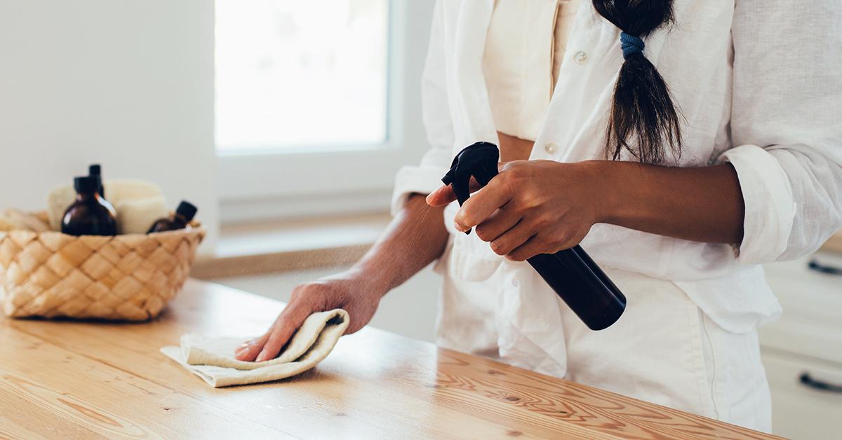 woman cleaning kitchen counter