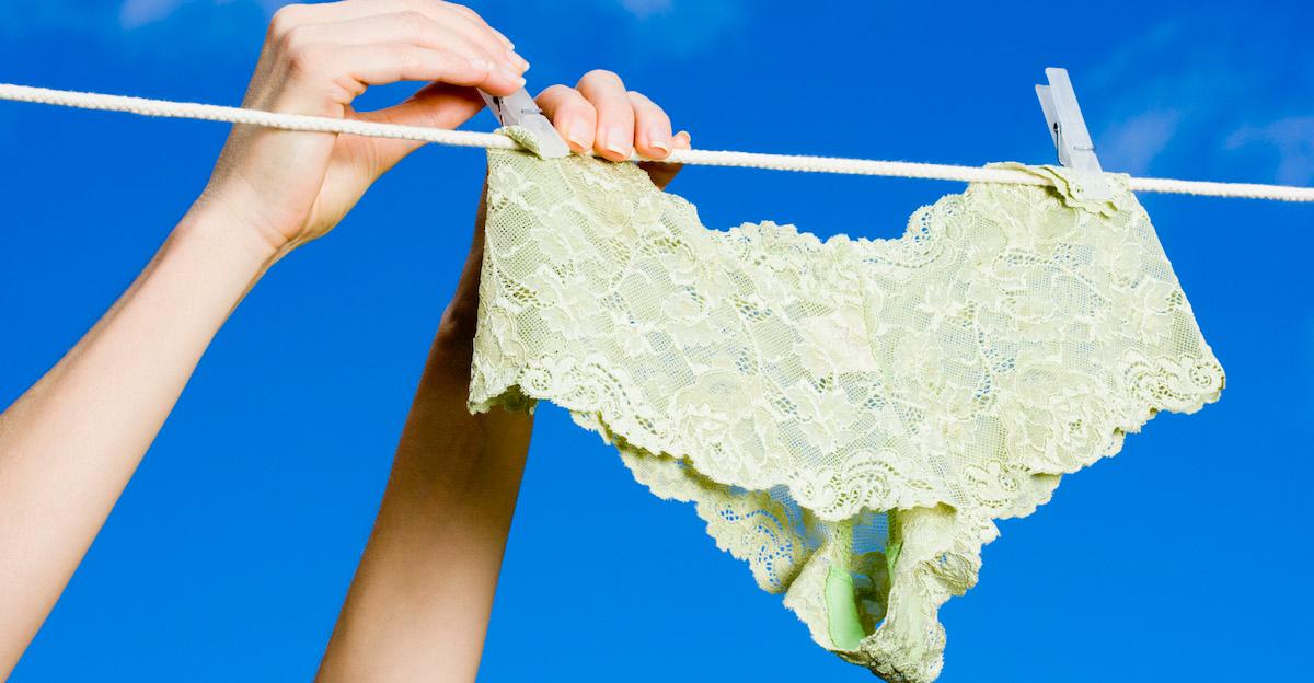 Green lacy underwear hanging on a clothesline.